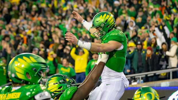 Oregon quarterback Bo Nix is hoisted into the air after a touchdown as the No. 6 Oregon Ducks take on the No. 16 Oregon State Beavers Friday, Nov. 24, 2023, at Autzen Stadium in Eugene, Ore.  